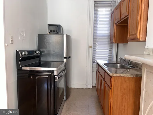 a close view of stove and microwave