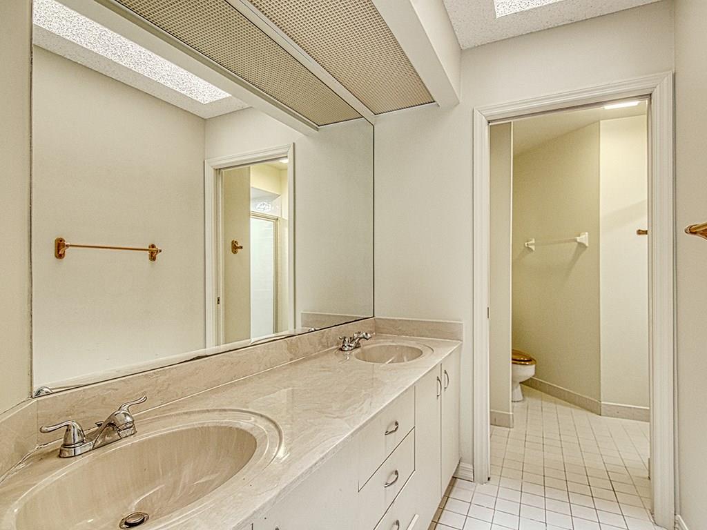 5270 Southeast Seascape Way, Unit 103 Stuart, FL 34997 - Photo 16 of 21 a bathroom with a sink and a mirror
