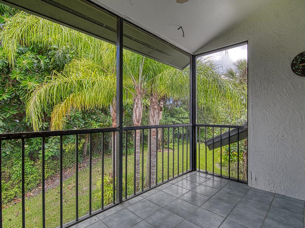 5270 Southeast Seascape Way, Unit 103 Stuart, FL 34997 - Photo 18 of 21 a view of a porch with a garden