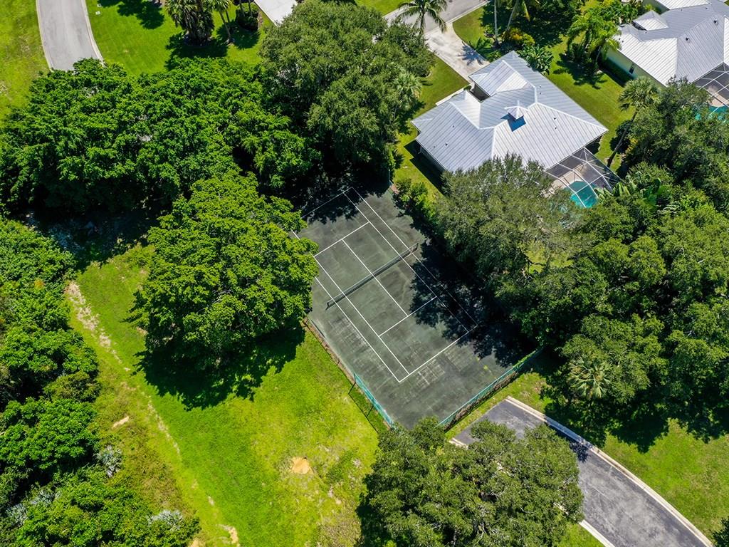 5270 Southeast Seascape Way, Unit 103 Stuart, FL 34997 - Photo 20 of 21 an aerial view of residential house with outdoor space and trees all around