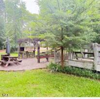 124 Kansas Drive Spring Hope, NC 27882 - Photo 8 of 10 a view of yard with swimming pool and sitting area
