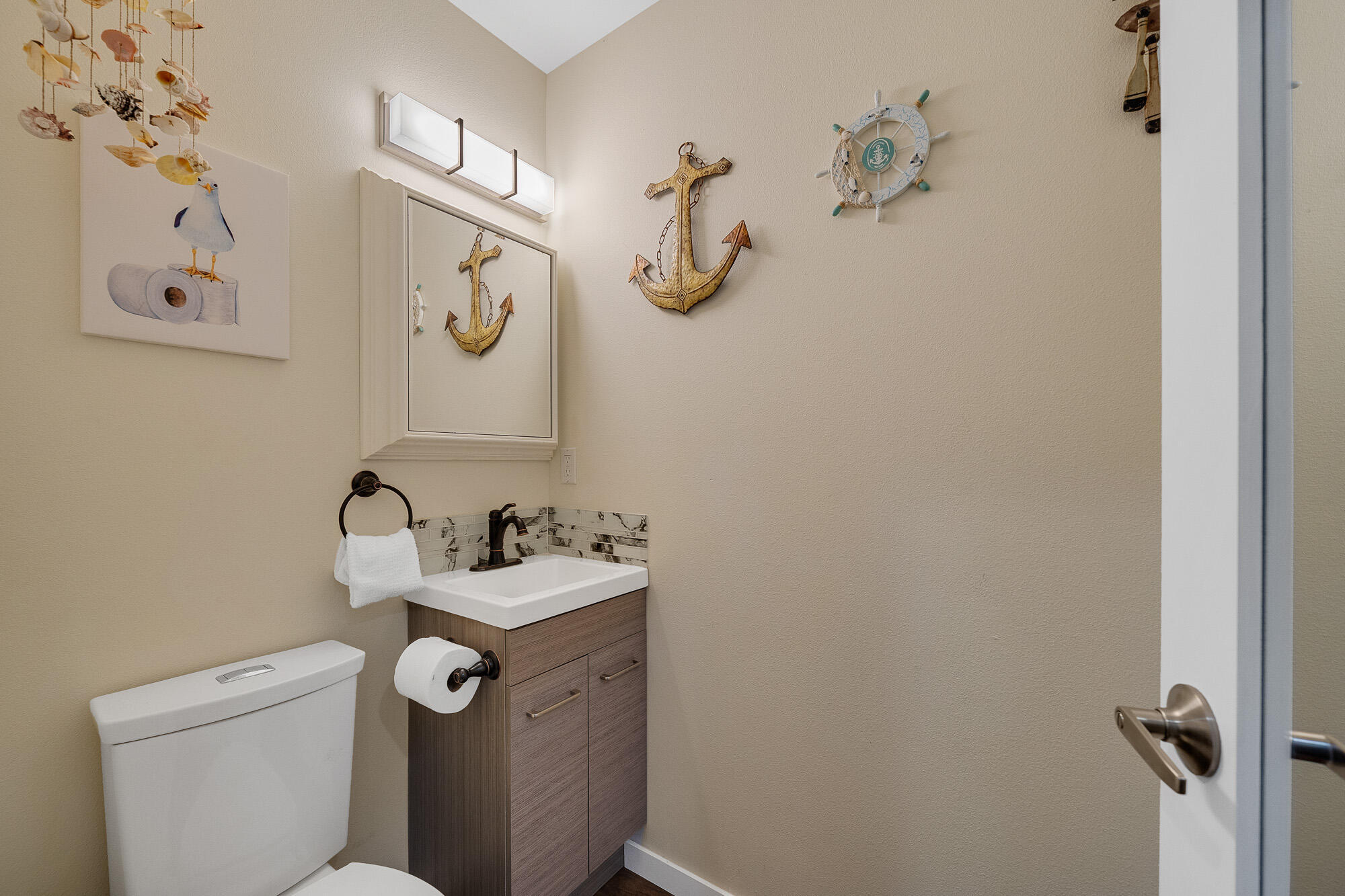 13150 D Street Nehalem, OR 97131 - Photo 12 of 29 a bathroom with a sink and mirror with toilet