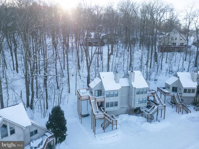 a view of a chairs and table in patio