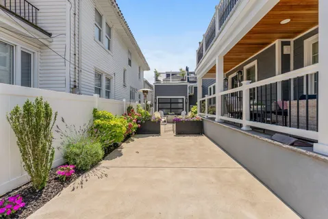 a view of a building with potted plants