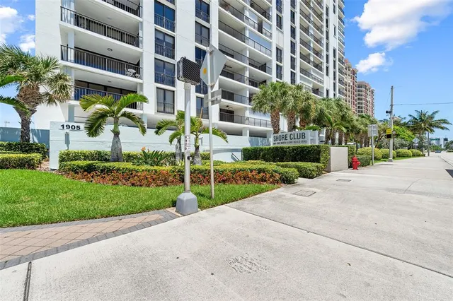 a view of buildings with yard