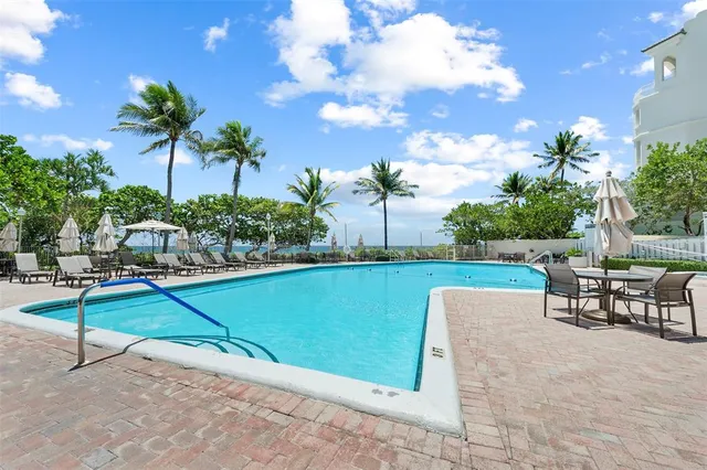 a view of a garden with sitting area