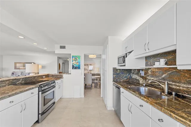 a kitchen with a stove and a sink