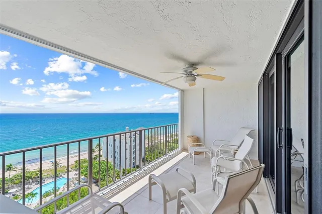 a view of a balcony with furniture