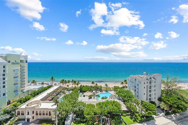 a view of a city with an ocean