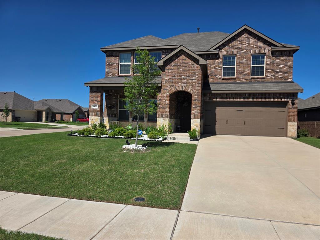 205 Redstone Lane Caddo Mills, TX 75135 - Photo 1 of 5 a front view of a house with a yard