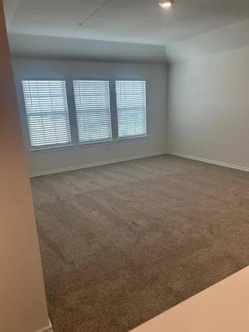 a kitchen with stainless steel appliances a refrigerator stove and microwave