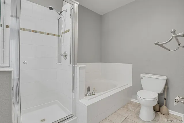 a spacious bedroom with a bed and window