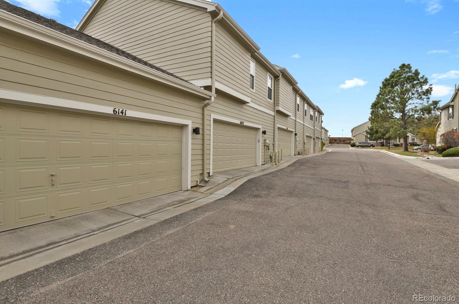 6141 Trailhead Road Highlands Ranch, CO 80130 - Photo 35 of 42 a view of a house with a garage