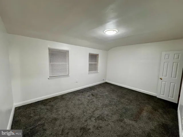 an empty room with a empty space and window