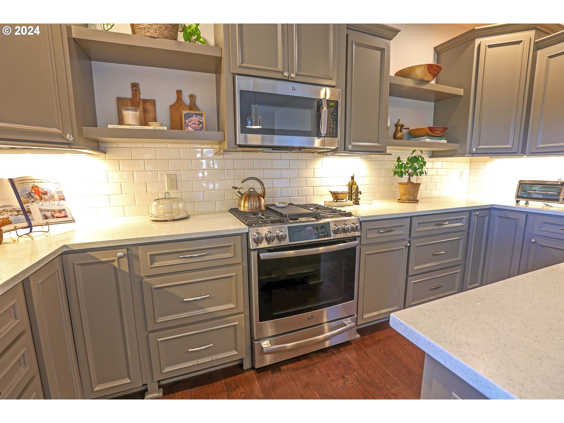 2230 Jeppesen Acres Road Eugene, OR 97401 - Photo 11 of 39 a kitchen with stainless steel appliances a stove microwave and cabinets