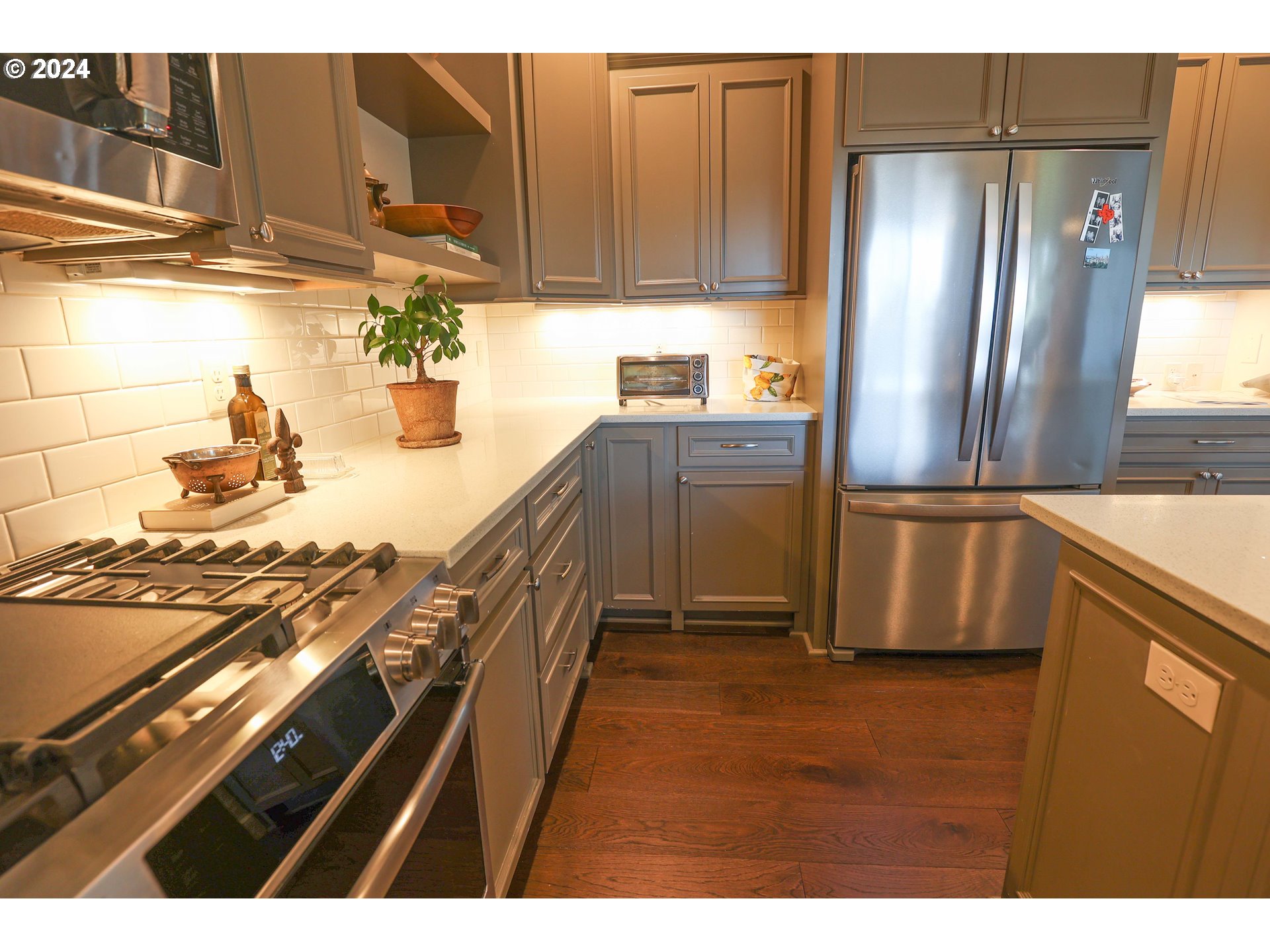 2230 Jeppesen Acres Road Eugene, OR 97401 - Photo 12 of 39 a kitchen with stainless steel appliances granite countertop a refrigerator and a stove