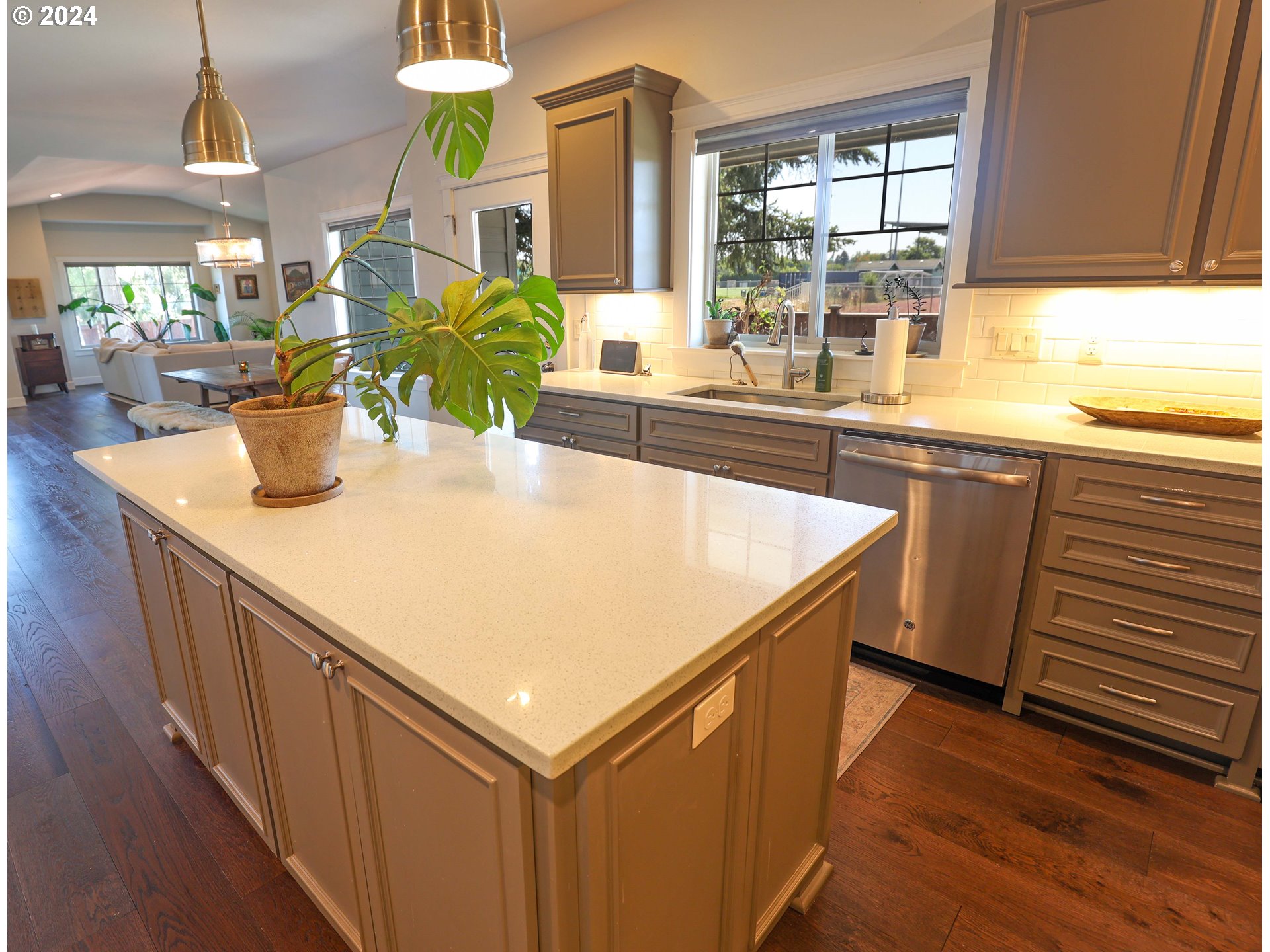 2230 Jeppesen Acres Road Eugene, OR 97401 - Photo 13 of 39 a kitchen with kitchen island a large counter top space and wooden floor