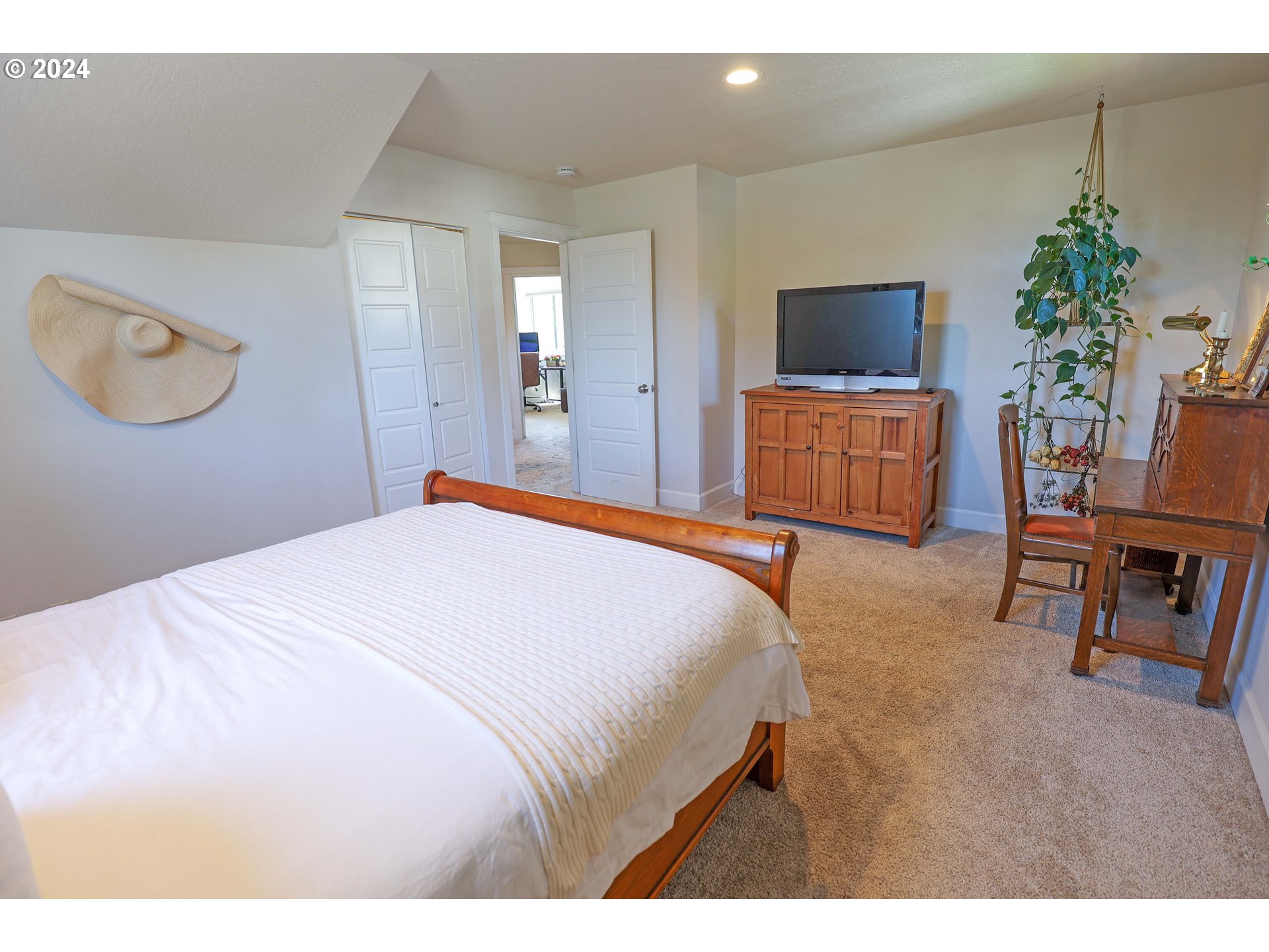 2230 Jeppesen Acres Road Eugene, OR 97401 - Photo 26 of 39 a bedroom with a large bed and a flat screen tv