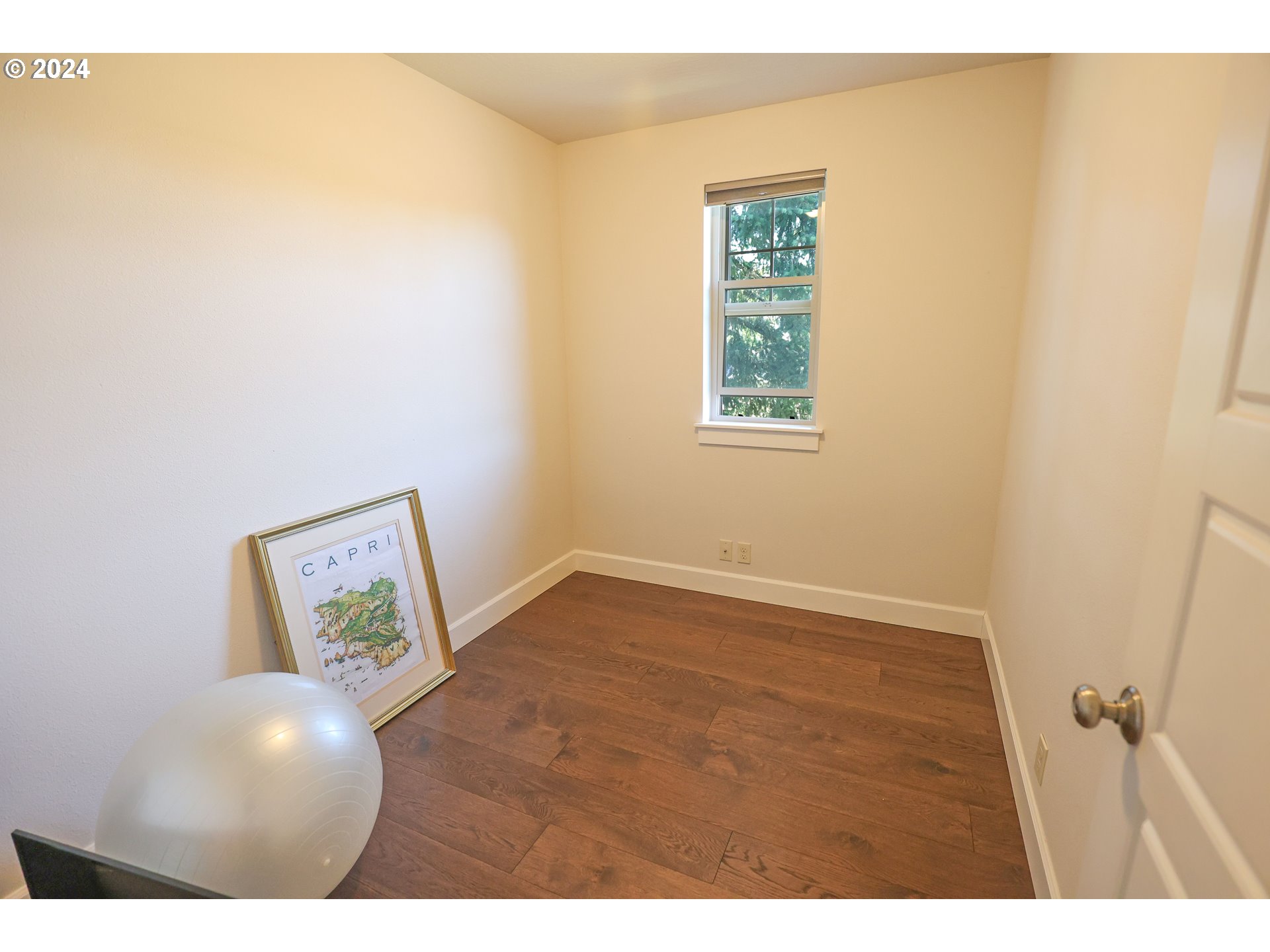 2230 Jeppesen Acres Road Eugene, OR 97401 - Photo 29 of 39 a view of an empty room with window and wooden floor