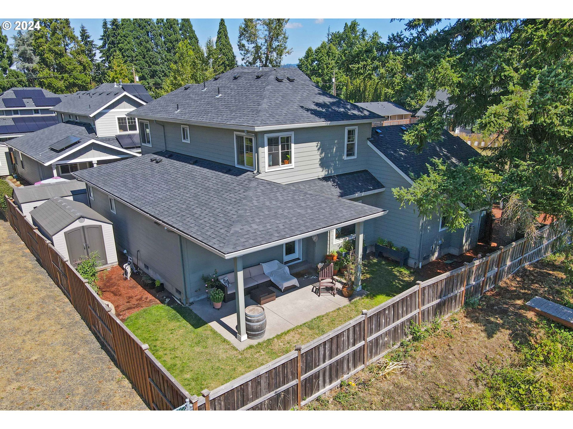 2230 Jeppesen Acres Road Eugene, OR 97401 - Photo 30 of 39 a aerial view of a house with a yard table and chairs