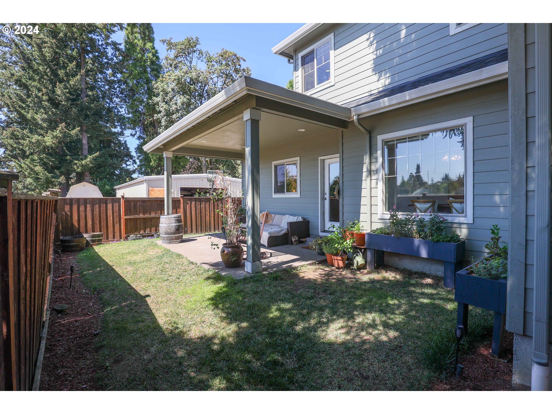 2230 Jeppesen Acres Road Eugene, OR 97401 - Photo 35 of 39 a view of a house with backyard porch and sitting area