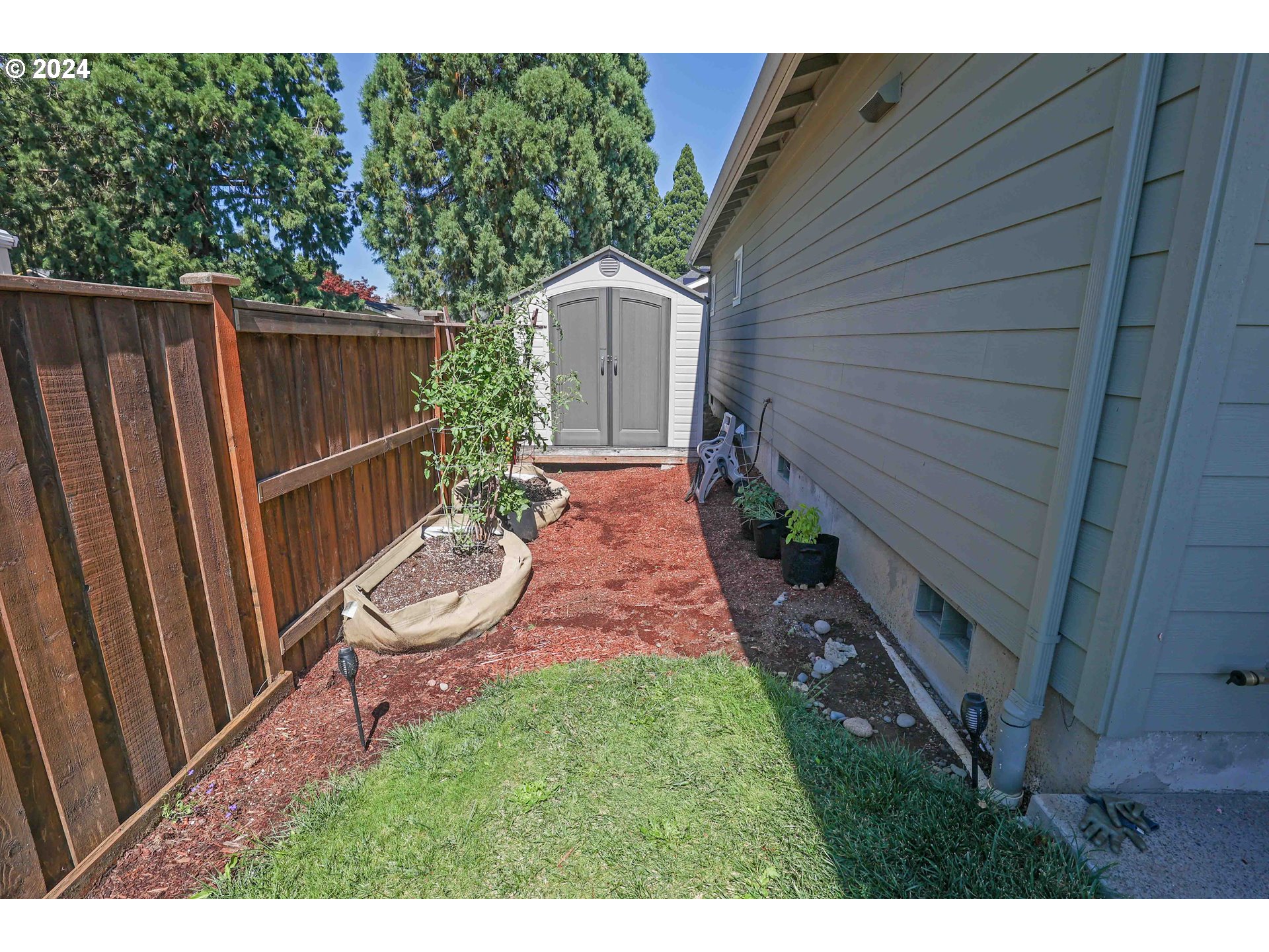 2230 Jeppesen Acres Road Eugene, OR 97401 - Photo 37 of 39 a view of a backyard with wooden fence and a bench