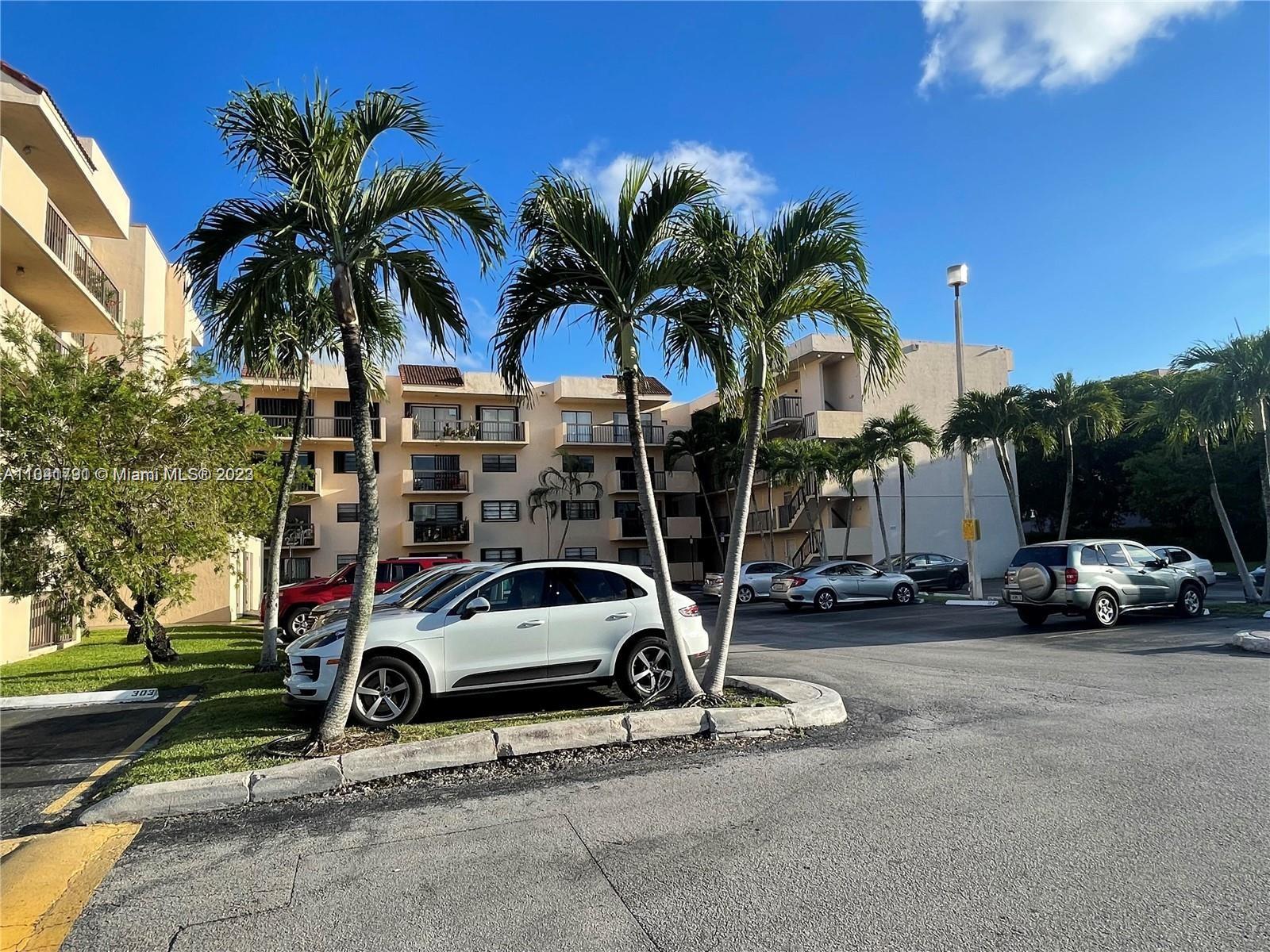 a view of street with parked cars