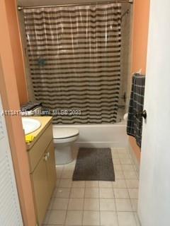 Westchester Miami, FL 33144 - Photo 8 of 9 a bathroom with a sink a toilet and shower curtain
