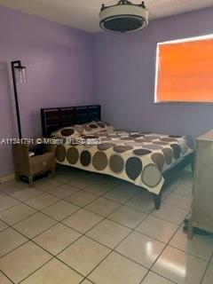 Westchester Miami, FL 33144 - Photo 9 of 9 a bedroom with a bed and a chair