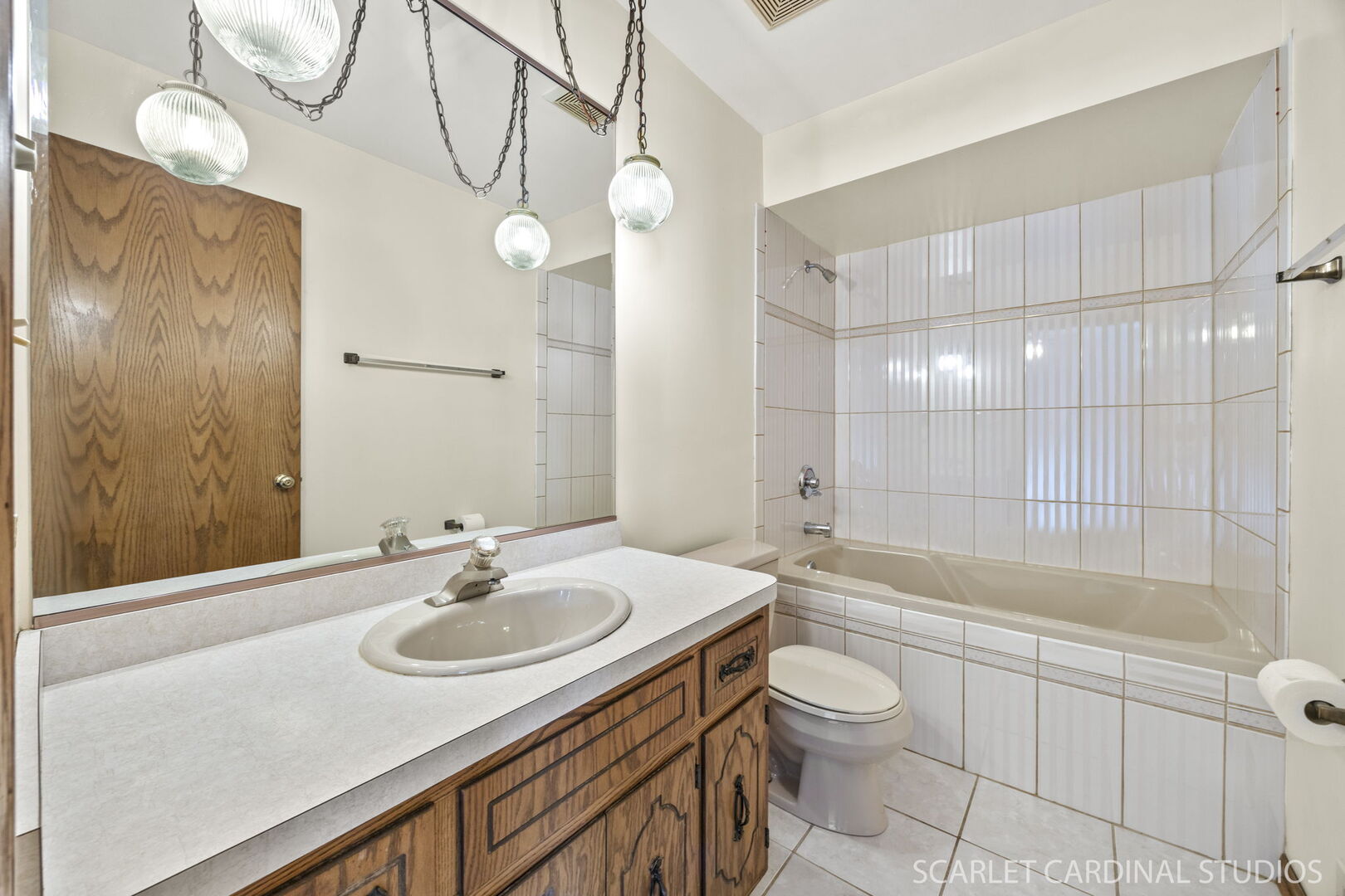 8214 45th Street Lyons, IL 60534 - Photo 11 of 24 a bathroom with a sink a toilet and shower