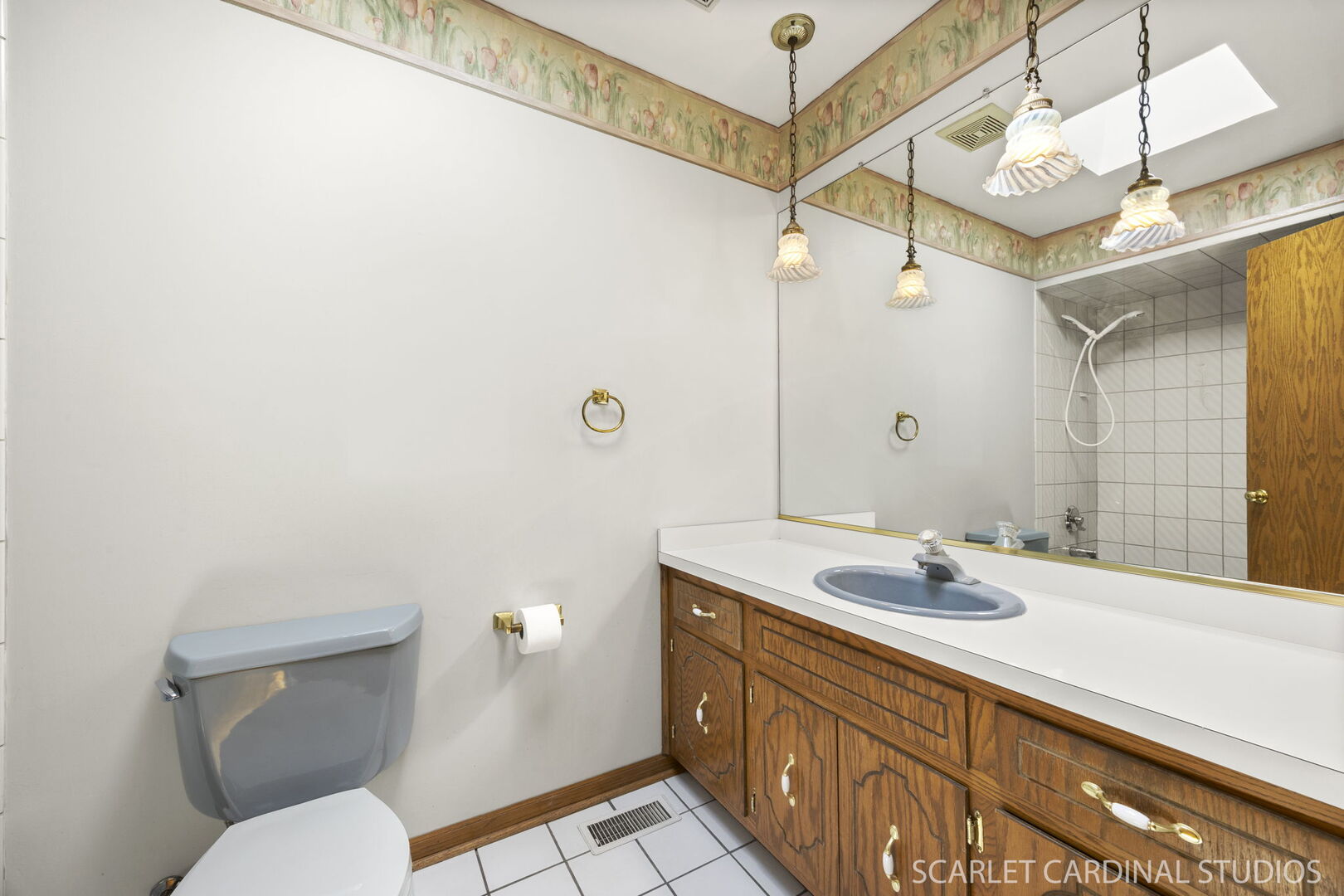 8214 45th Street Lyons, IL 60534 - Photo 14 of 24 a bathroom with a sink a toilet and shower
