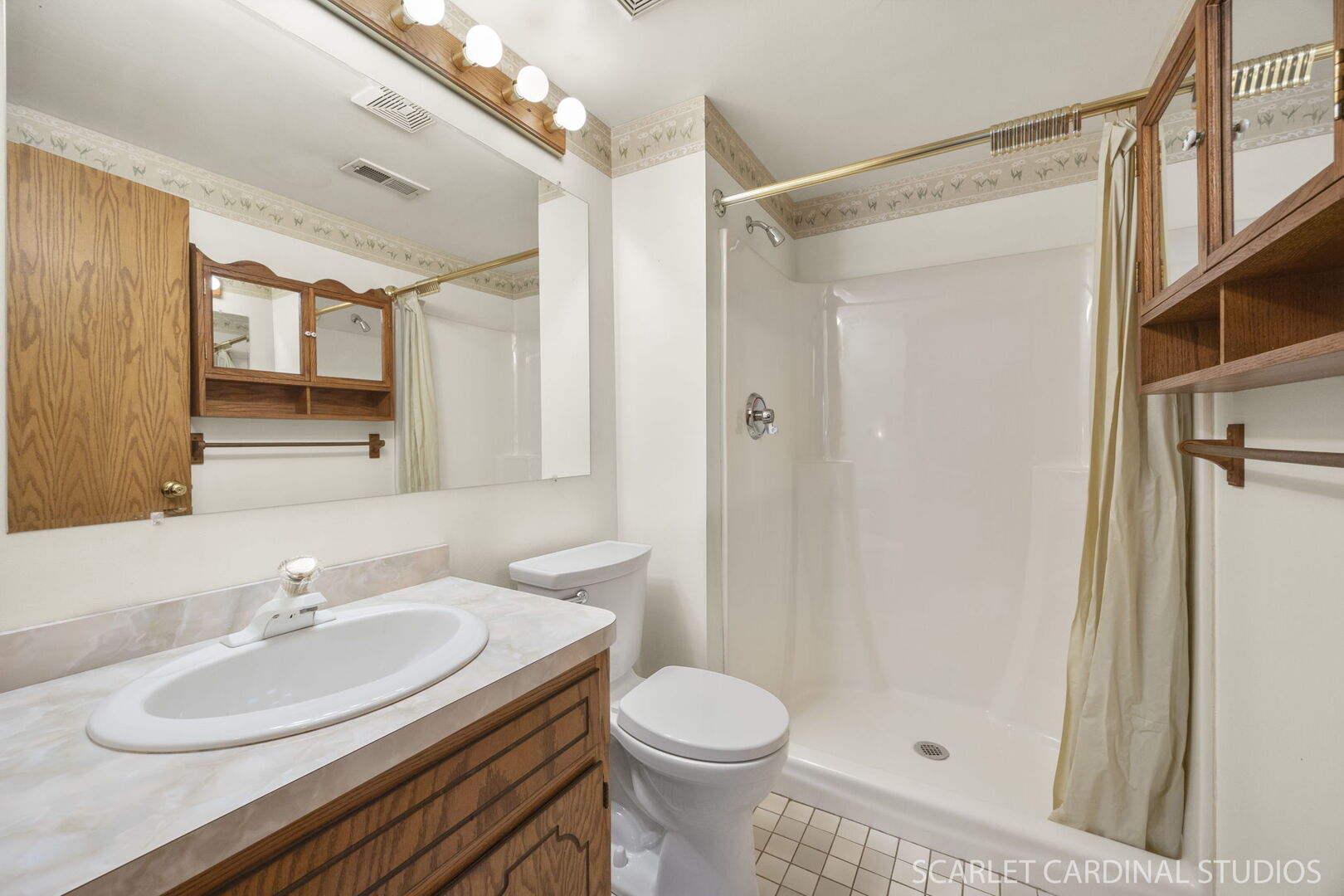 8214 45th Street Lyons, IL 60534 - Photo 16 of 24 a bathroom with a sink toilet and shower