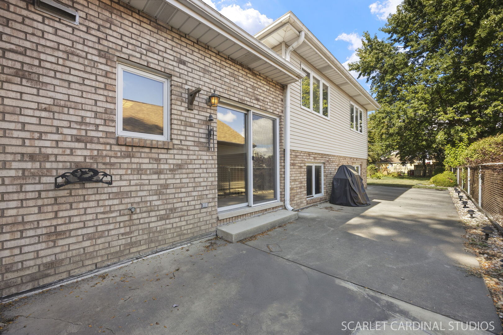 8214 45th Street Lyons, IL 60534 - Photo 19 of 24 a view of a house with a patio