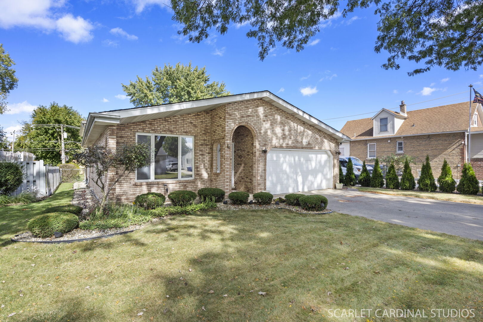 8214 45th Street Lyons, IL 60534 - Photo 23 of 24 a front view of a house with garden
