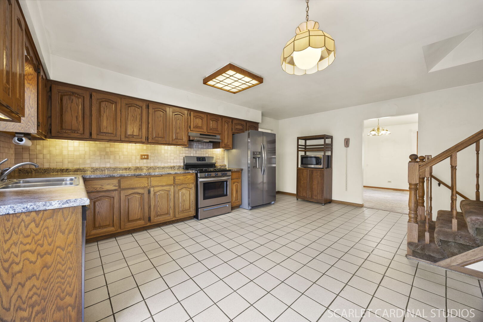 8214 45th Street Lyons, IL 60534 - Photo 4 of 24 a kitchen with stainless steel appliances granite countertop a stove a sink dishwasher and a refrigerator with wooden floor