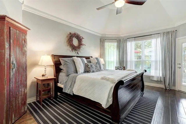 a spacious bathroom with a granite countertop sink a toilet a mirror and shower