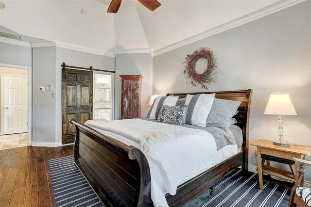 a large white kitchen with a sink and cabinets