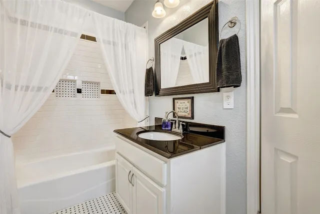 a living room with furniture and a rug