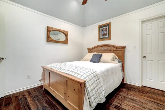 a living room with patio furniture and a potted plants