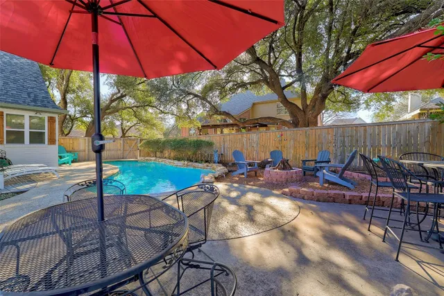 a view of yard with swimming pool