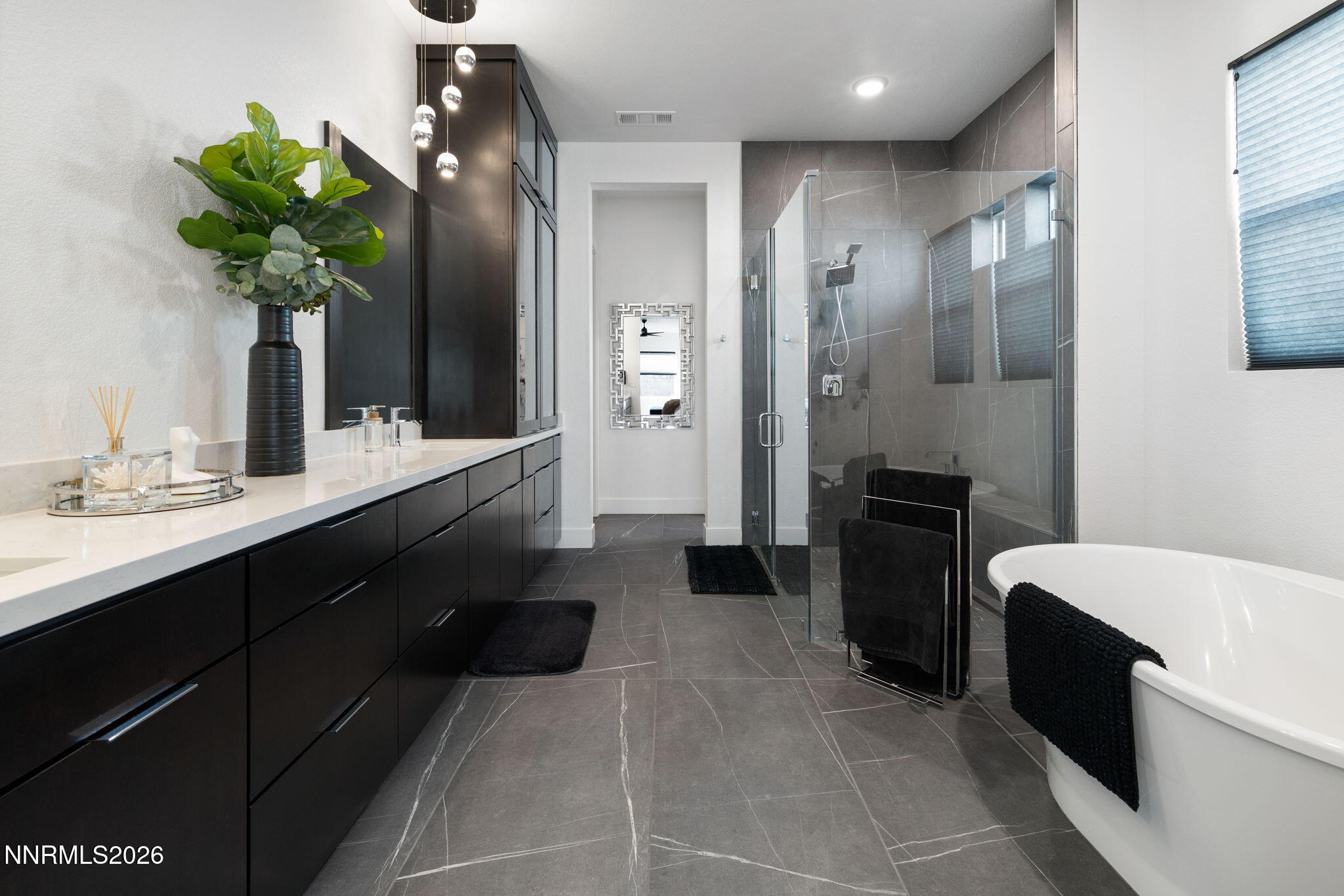 940 Little Star Drive Reno, NV 89511 - Photo 11 of 21 a bathroom with a sink a vanity and a mirror