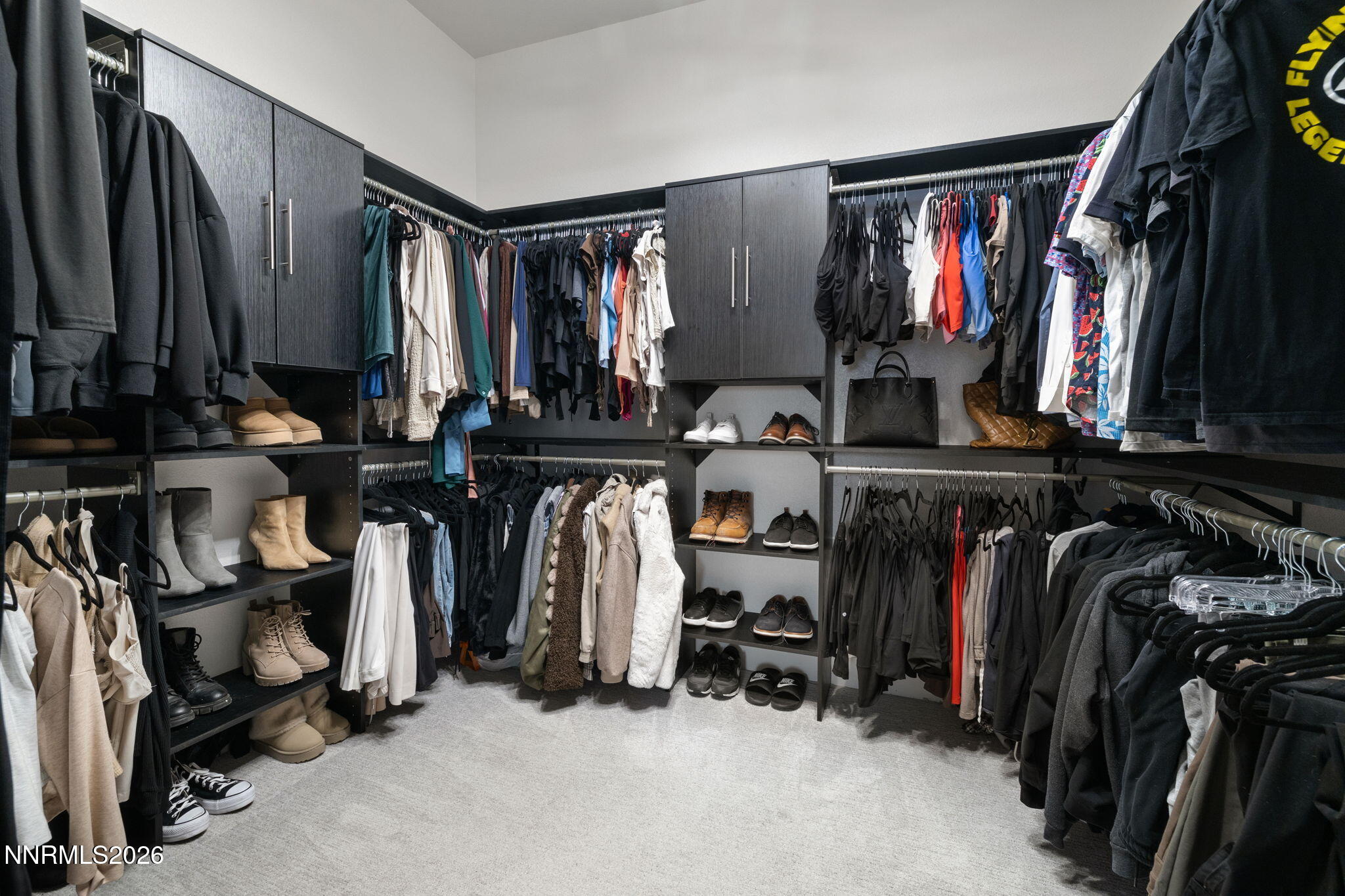 940 Little Star Drive Reno, NV 89511 - Photo 14 of 21 a view of walk in closet with clothes and shoes