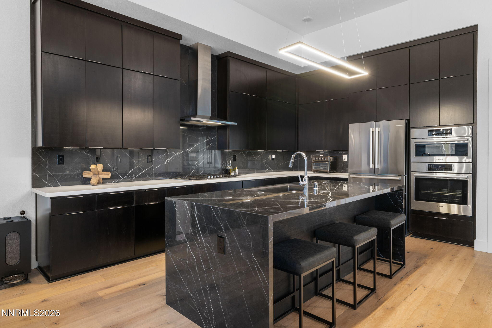 940 Little Star Drive Reno, NV 89511 - Photo 6 of 21 a kitchen with kitchen island stainless steel appliances a sink stove and refrigerator