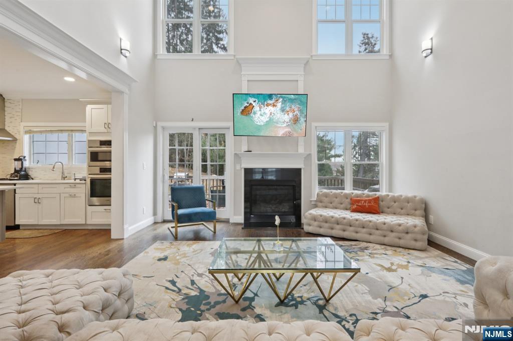 680 Soldier Hill Road Oradell, NJ 07649 - Photo 11 of 47 a living room with furniture and a fireplace