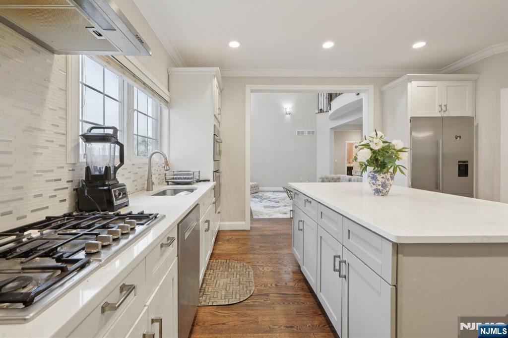 680 Soldier Hill Road Oradell, NJ 07649 - Photo 24 of 47 a spacious kitchen with stainless steel appliances a sink and cabinets