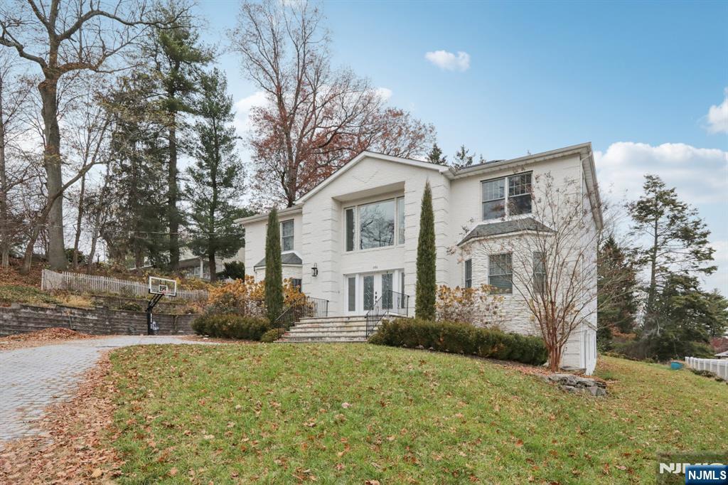 680 Soldier Hill Road Oradell, NJ 07649 - Photo 3 of 47 a front view of a house with a yard
