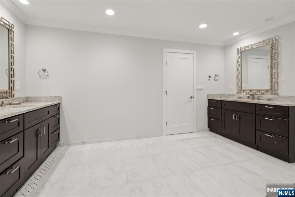 680 Soldier Hill Road Oradell, NJ 07649 - Photo 32 of 47 a spacious bathroom with a granite countertop sink and a mirror