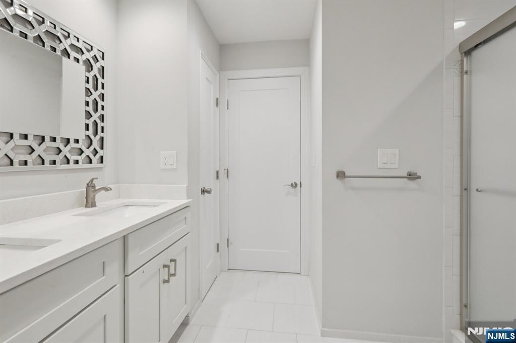 680 Soldier Hill Road Oradell, NJ 07649 - Photo 39 of 47 a bathroom with a sink and a mirror
