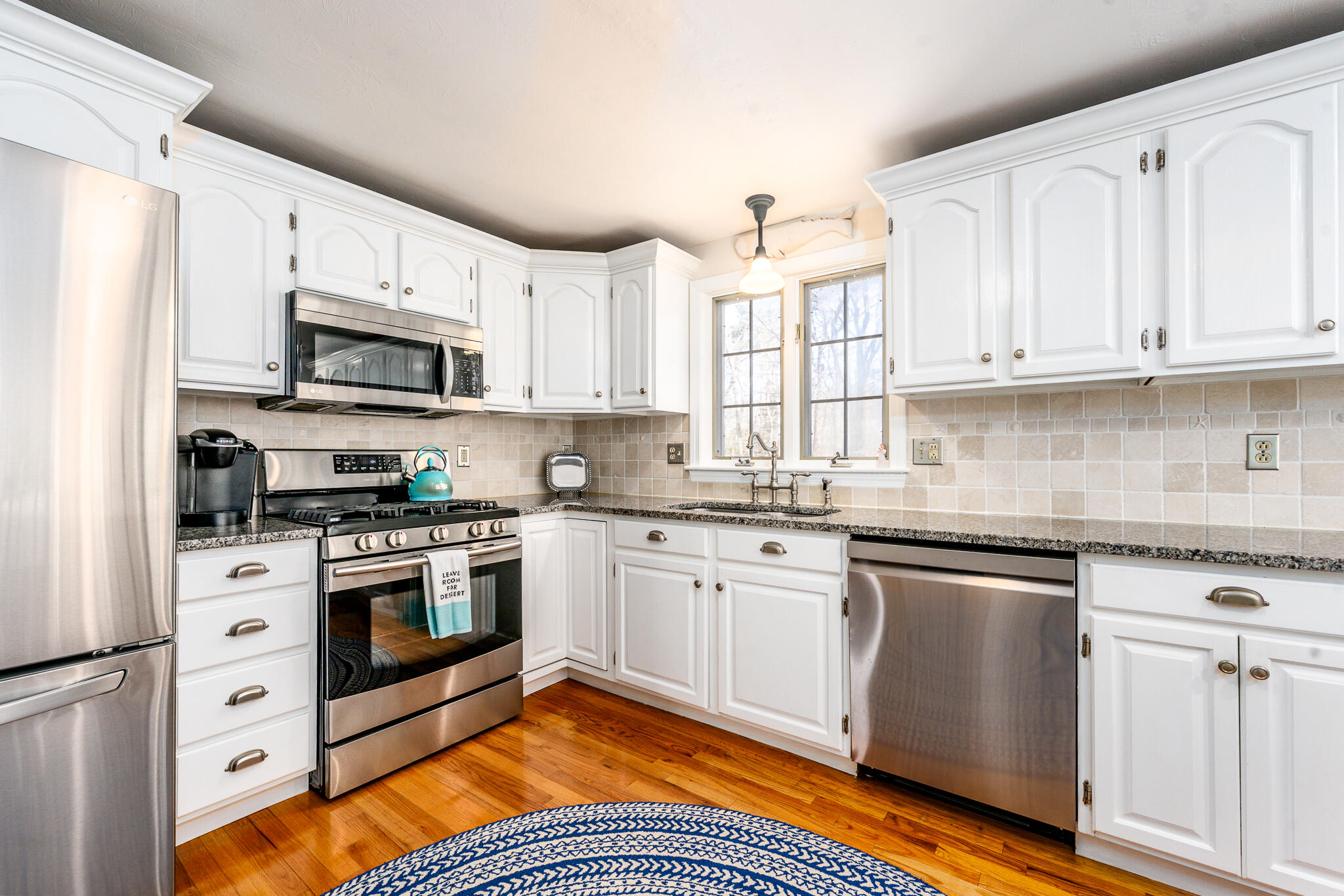42 Eventide Lane Hyannis, MA 02601 - Photo 3 of 39 a kitchen with stainless steel appliances granite countertop a stove a sink and a microwave