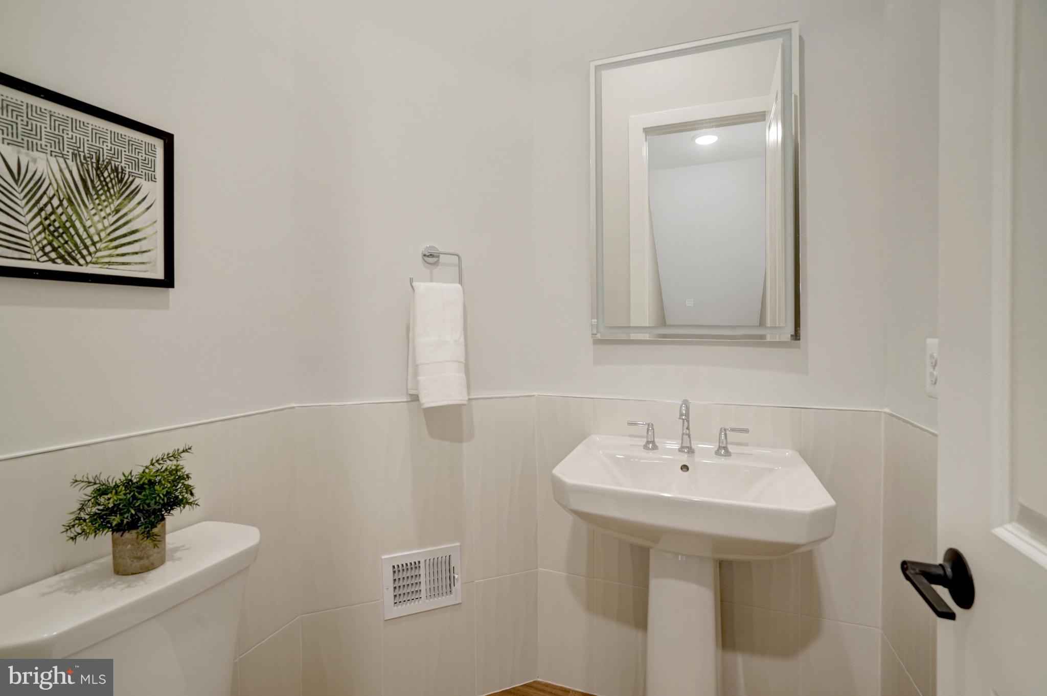 2605 Fall Line Street Alexandria, VA 22301 - Photo 16 of 71 a bathroom with a sink a mirror and vanity